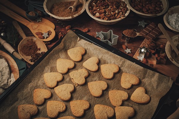 Heart-shaped biscuits baked on a baking tray