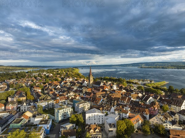 Aerial view of the town of Radolfzell on Lake Constance with the Radolfzell Minster in front of sunset