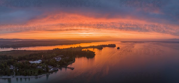 Aerial panorama of western Lake Constance in front of sunrise with the Mettnau peninsula