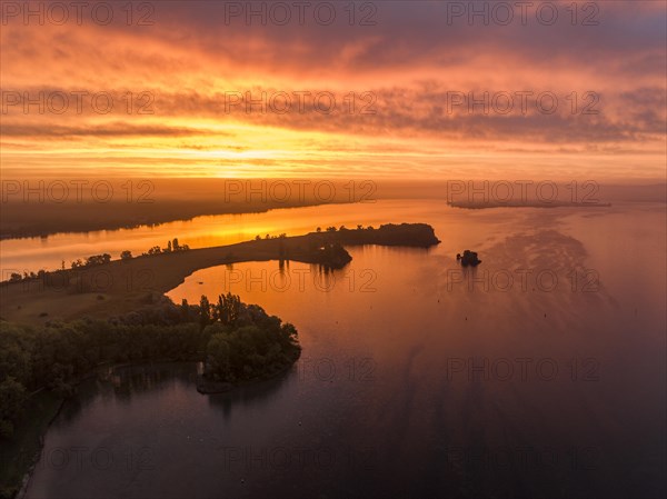 Aerial view of western Lake Constance in front of sunrise with the Mettnau peninsula