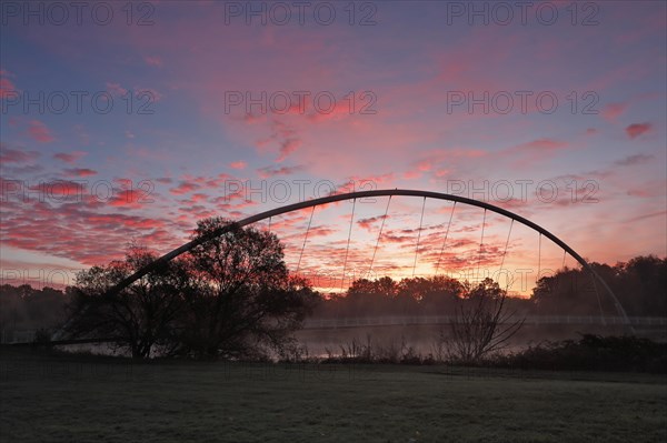 Bridge over the river Mulde near Dessau-Rosslau in the morning with atmospheric cloudy sky