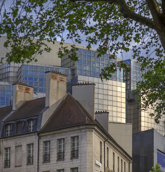 Historic houses in front of the modern Paris Opera