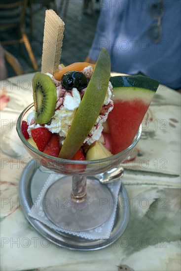 Ice cream sundae with fruit in an Italian ice cream parlour