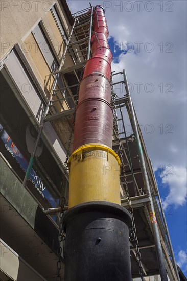 Scaffolding and rubble chute on a house