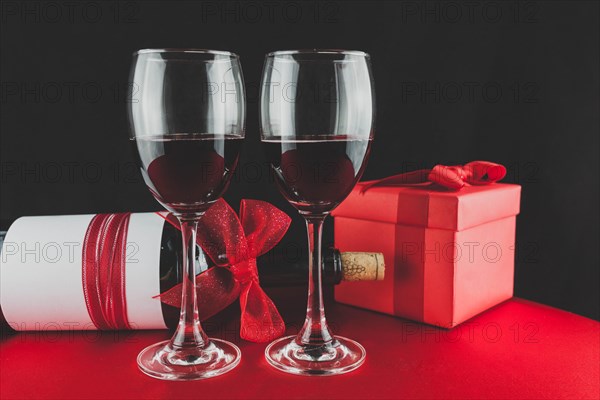 Gift with bottle wine two glasses with red wine