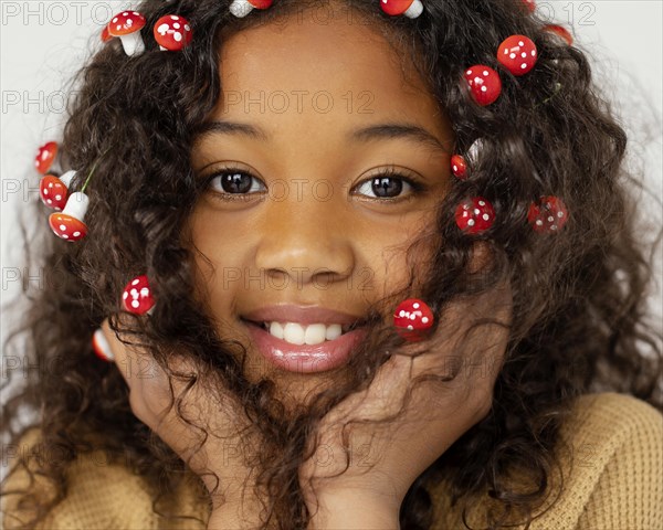 Girl posing with little mushrooms