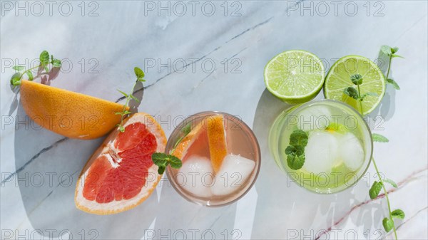Glasses citrus drink with sliced fruit