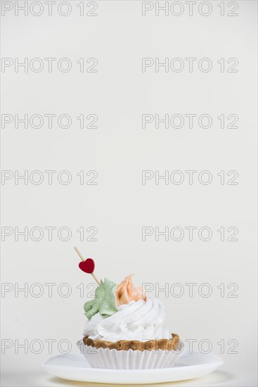 Heart topper cupcake white table