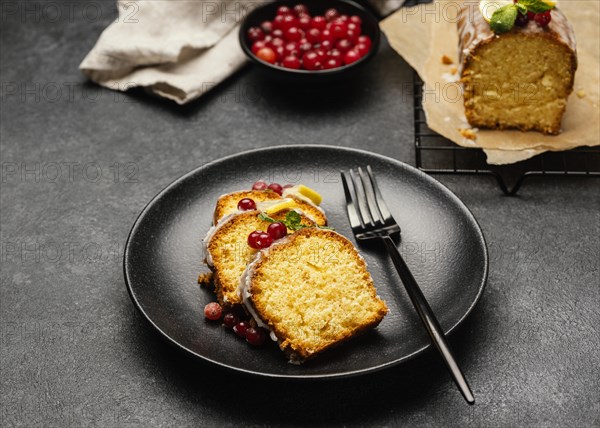 High angle cake slices plate with fork berries