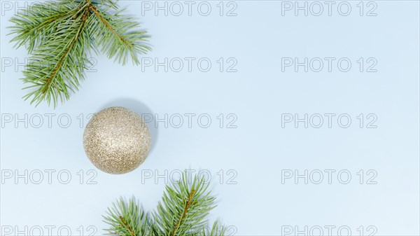 Minimalist christmas ball pine leaves with copy space