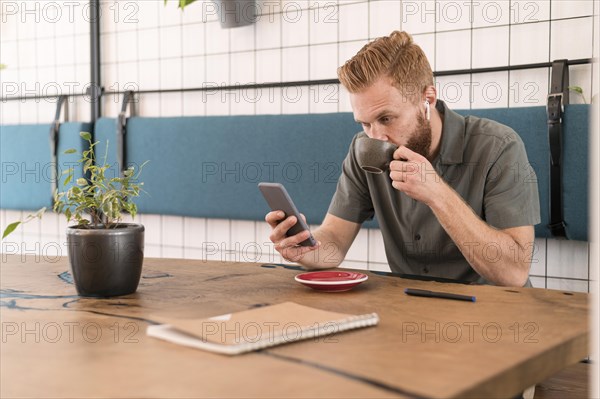 Modern man looking his phone