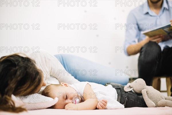 Mother sleeping floor with baby