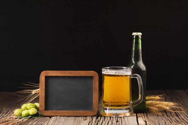 Mug bottle beer wooden background