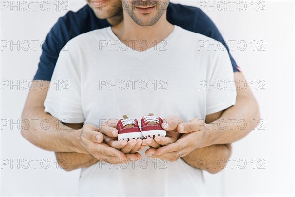 Newborn concept with gay couple