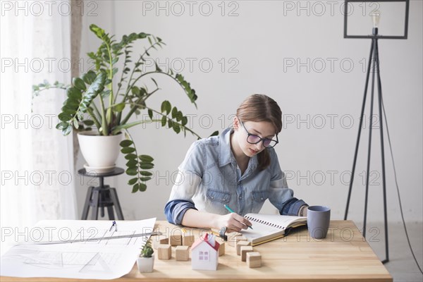 Overhead view female real estate agent working office
