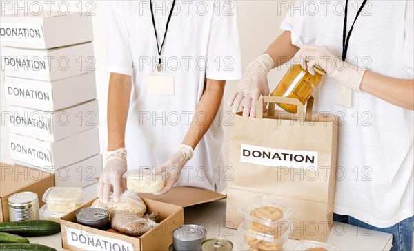 People preparing food box bag donation