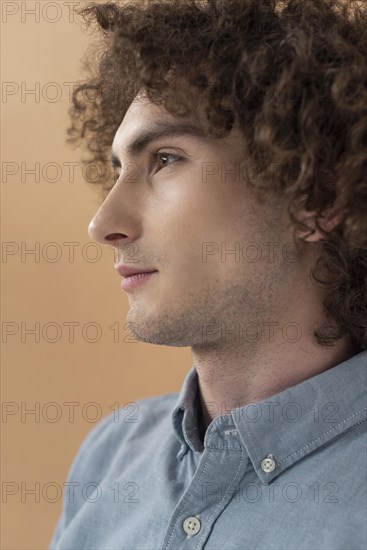 Portrait curly haired young man