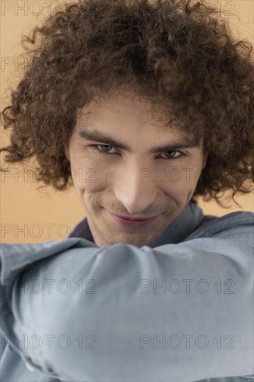 Portrait curly haired young man 2