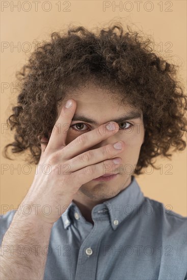 Portrait curly haired young man 3