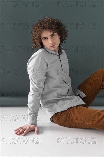 Portrait curly haired young man 8
