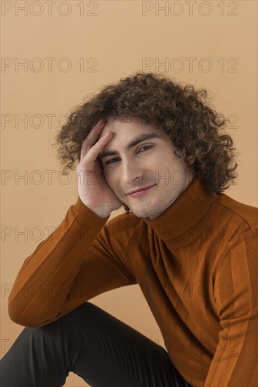 Portrait curly haired young man 13