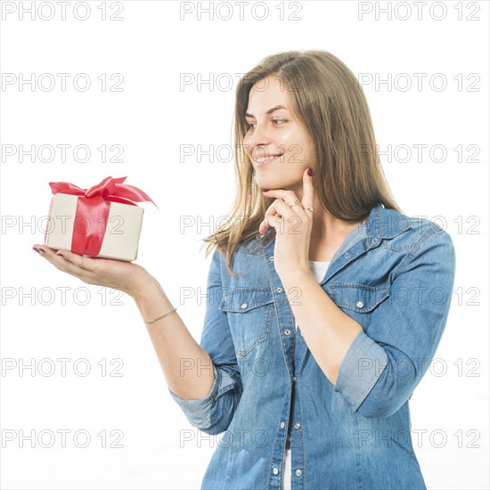 Portrait happy woman looking gift white background