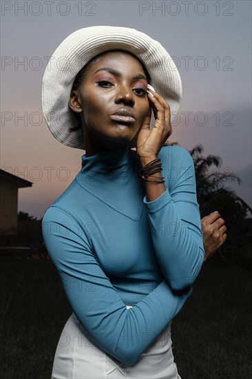 Portrait young woman posing with hat 2