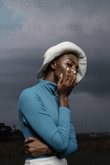 Portrait young woman posing with hat 3