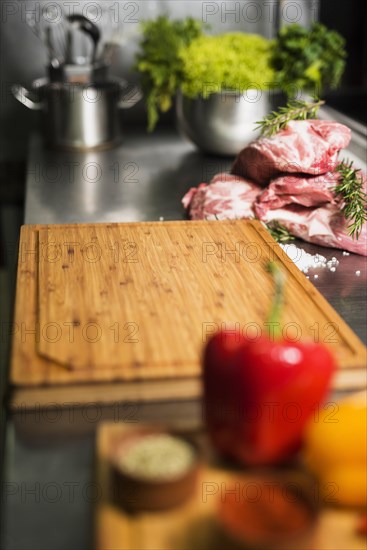 Raw meat steaks with wooden board table