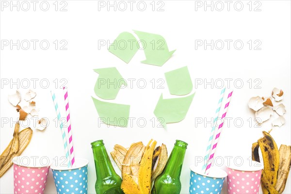 Recycle logo with garbage