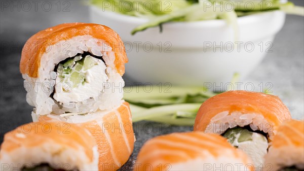 Salad fresh sushi rolls close up