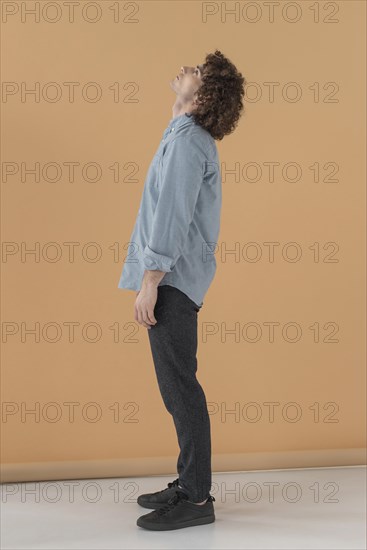Side view portrait curly haired young man 2