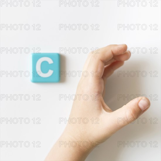 Sign language hand showing letter c