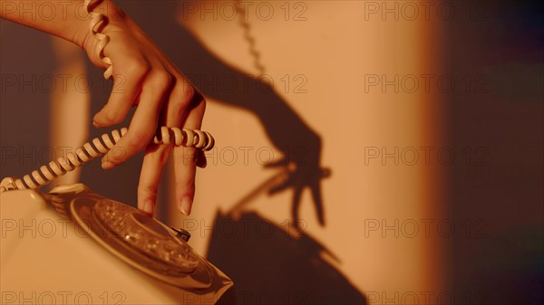 Silhouette woman using telephone