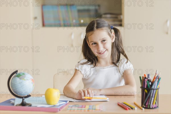 Smiling girl looking away during lesson
