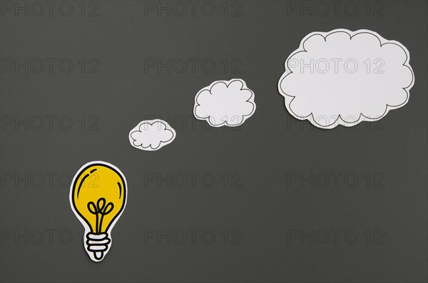 Speech bubbles idea concept light bulb black background