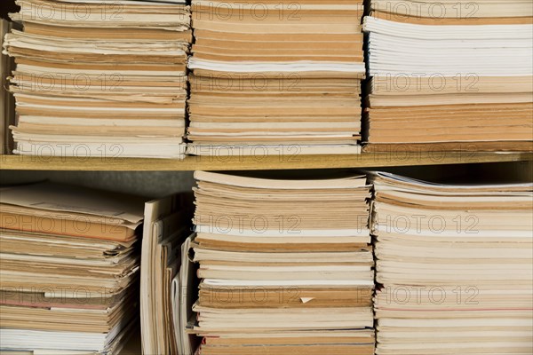 Stacked old notepads shelf