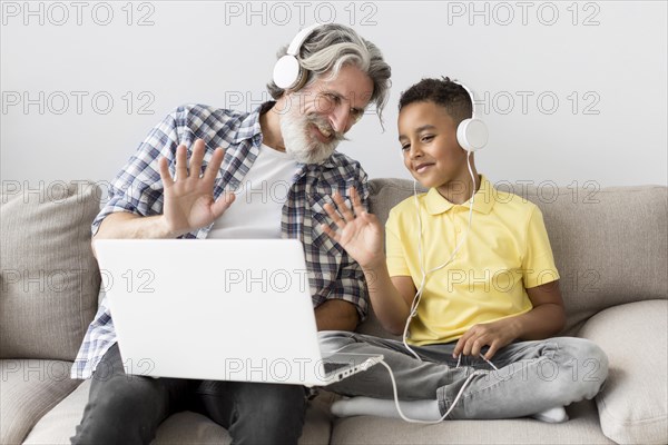 Student teacher waving laptop