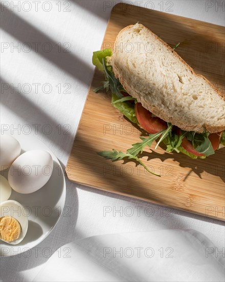 Toast sandwich with tomatoes greens hard boiled eggs