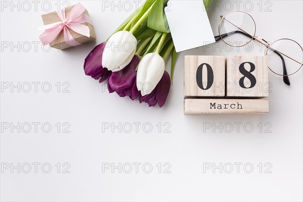 Top view 8 march lettering with tulips copy space