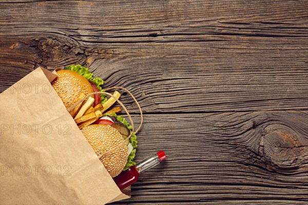 Top view burger with french fries bag