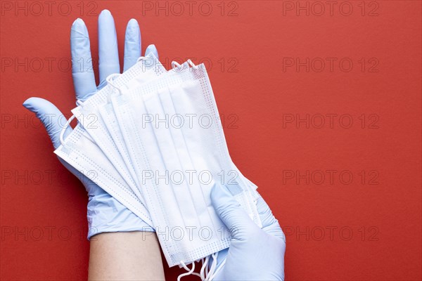 Top view hands holding medical masks