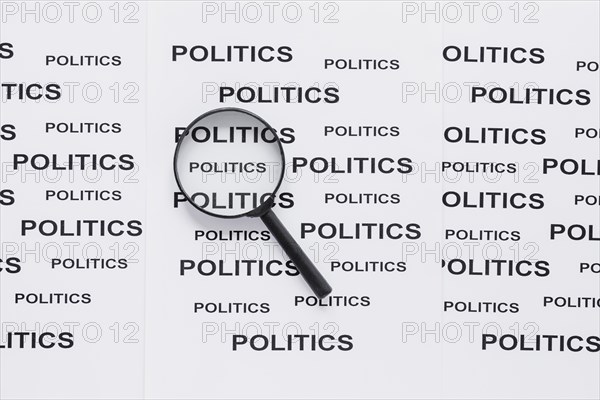 Top view magnifying glass with politics