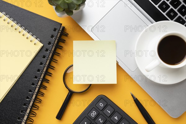 Top view office desk composition with empty post it