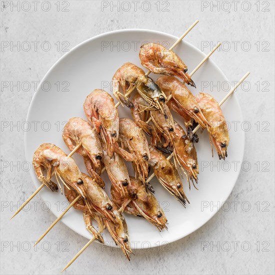 Top view plate with shrimp skewers