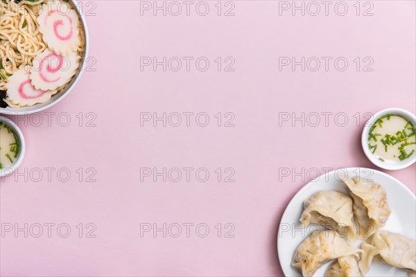 Top view ramen soup dumplings with copy space