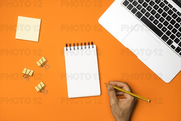 Top view workspace with orange background