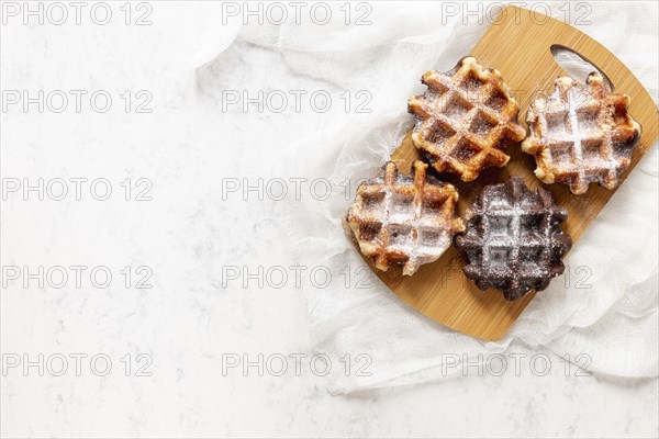 Top view yummy waffles white background