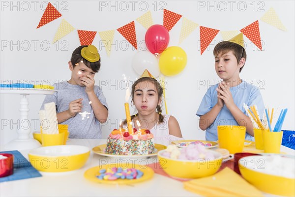 Two friends celebrating their friend s birthday home