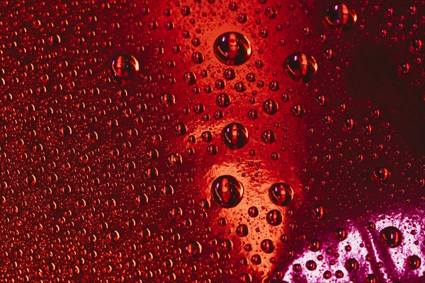 Water bubbles red textured background